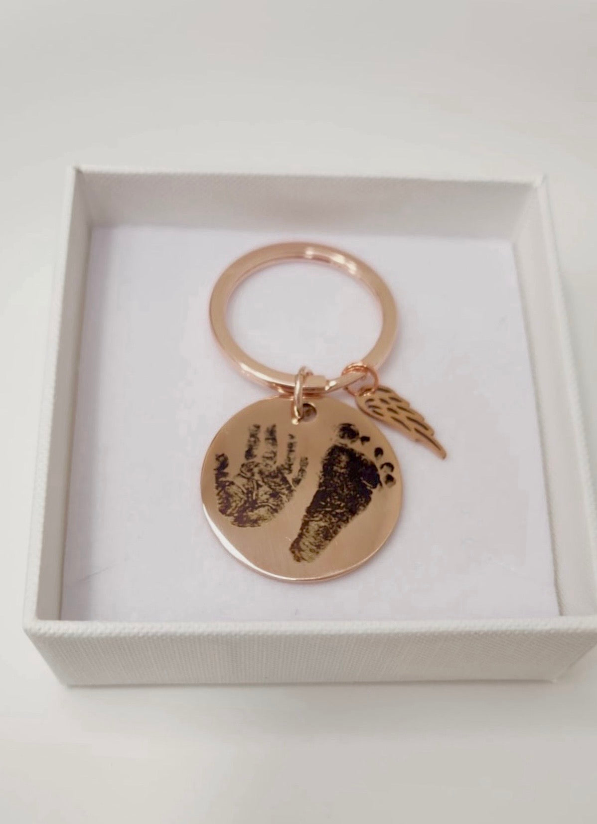 Rose Gold Circle Keyring With Angel Wing Charm
